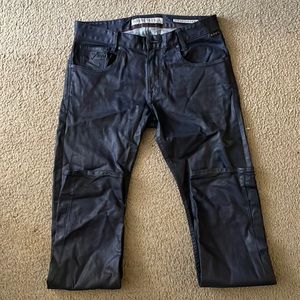 Leather style dark blue jeans (not true leather).